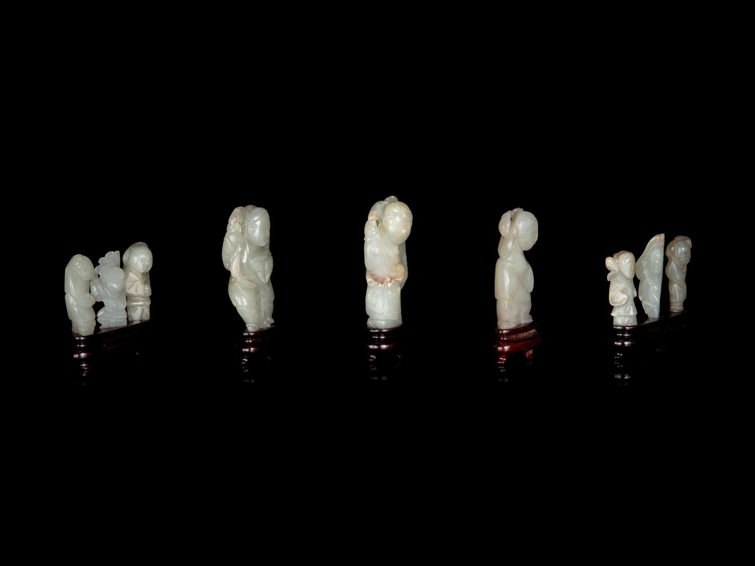 Nine Chinese Carved Celadon Jade Figures of Boys