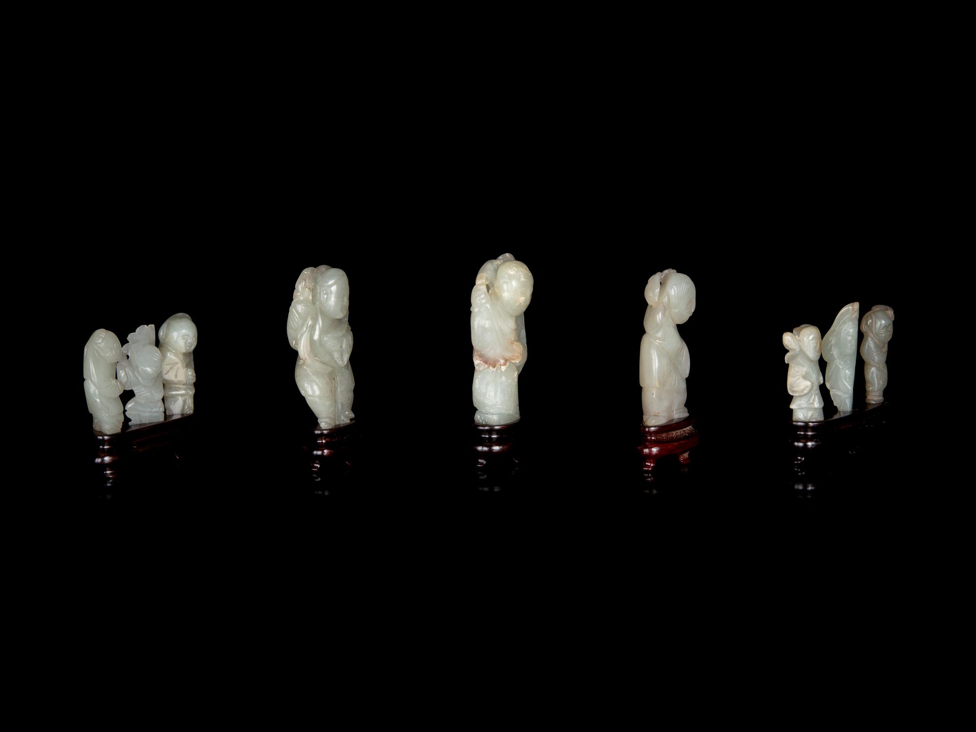 Nine Chinese Carved Celadon Jade Figures of Boys