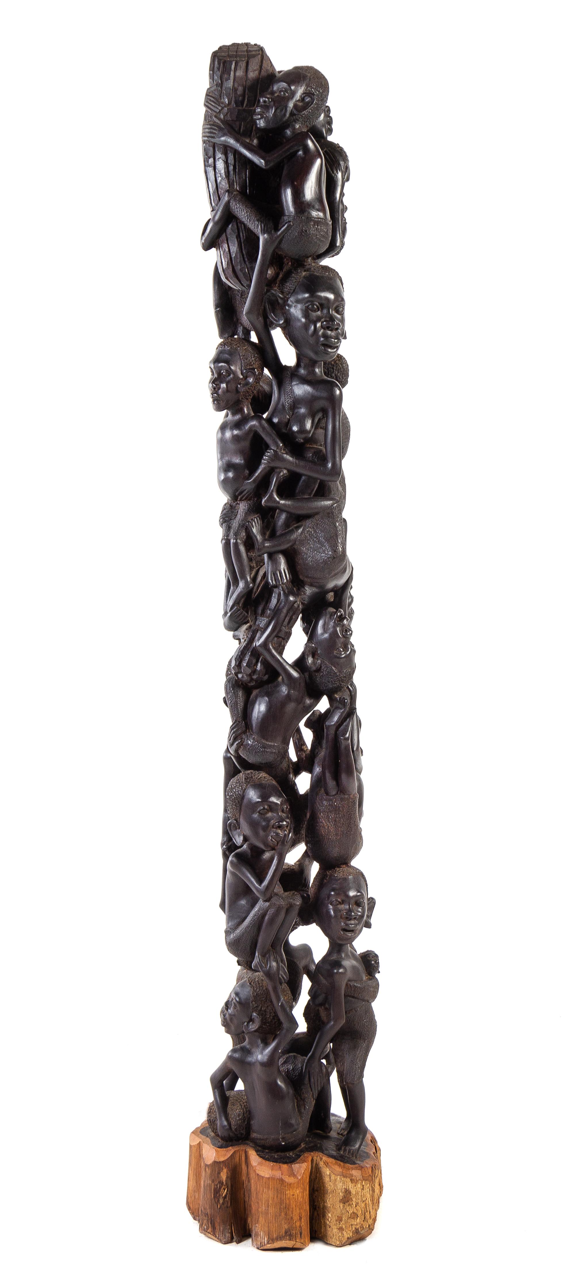 An African Carved Wood Totem Height 65 inches. — 20TH CENTURY