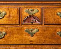 A Queen Anne Carved Figured Maple and Birch Flat-Top High Chest of Drawers