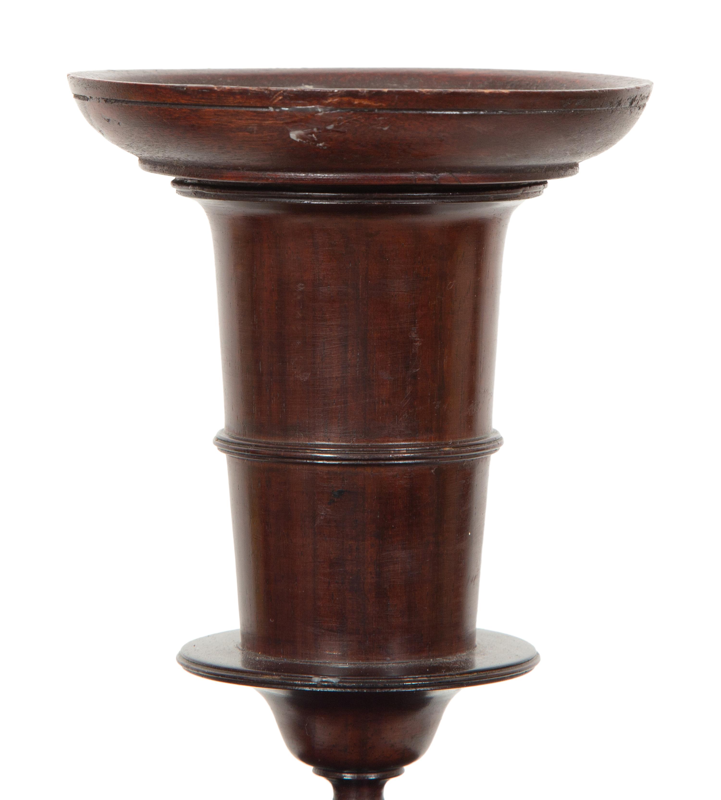A Pair of Portuguese Colonial Jacaranda Candlesticks