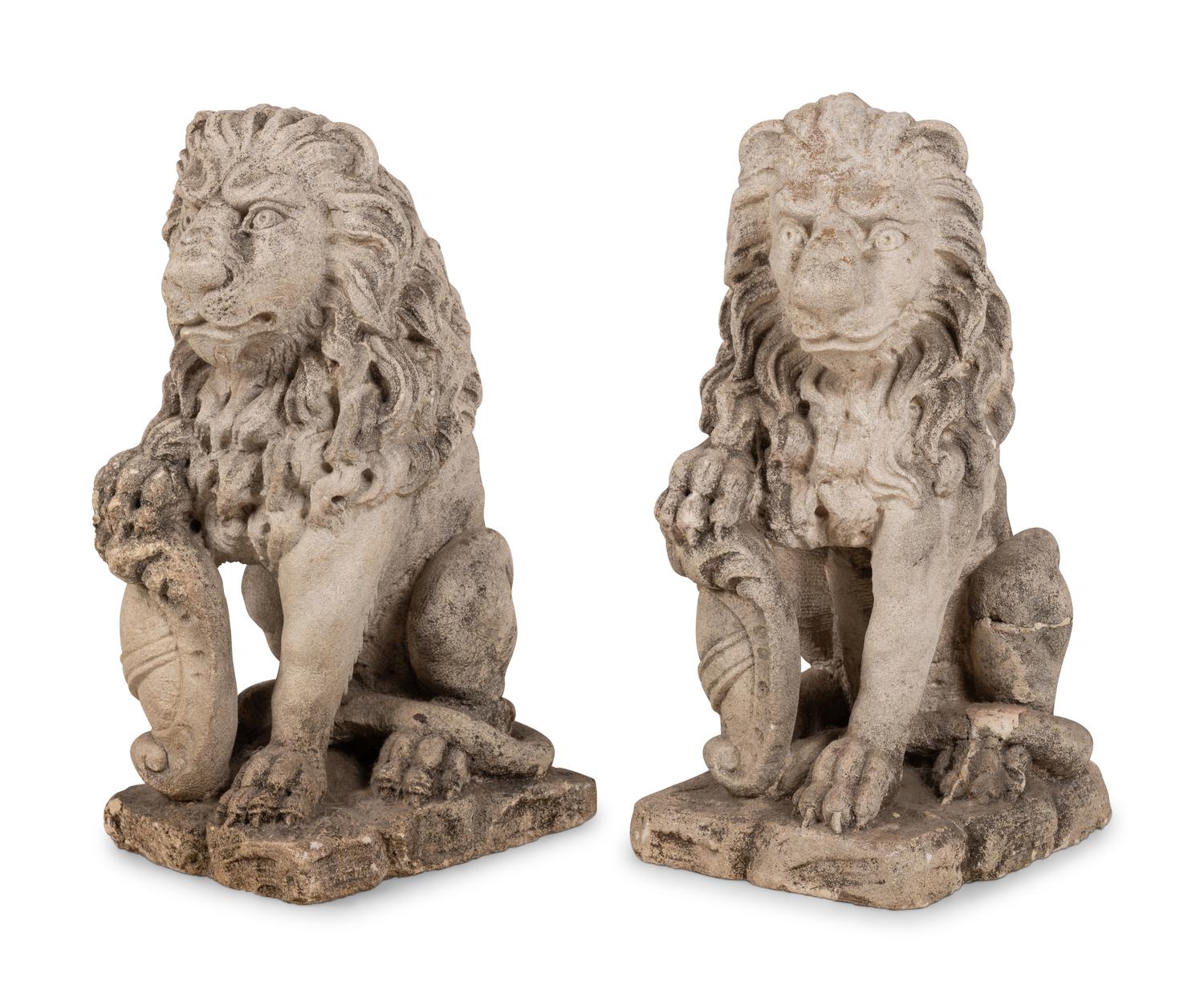 A Pair of Cast Stone Lion Figures