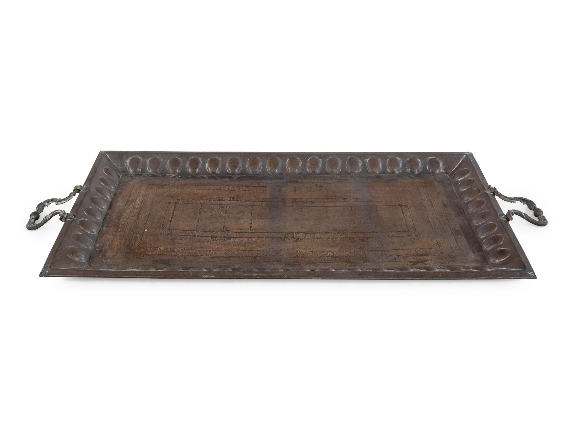 A Large Middle Eastern Damascened Brass Tray