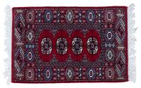 A Bokhara Wool Rug 3 feet 2 inches x 2 feet 1 inch.