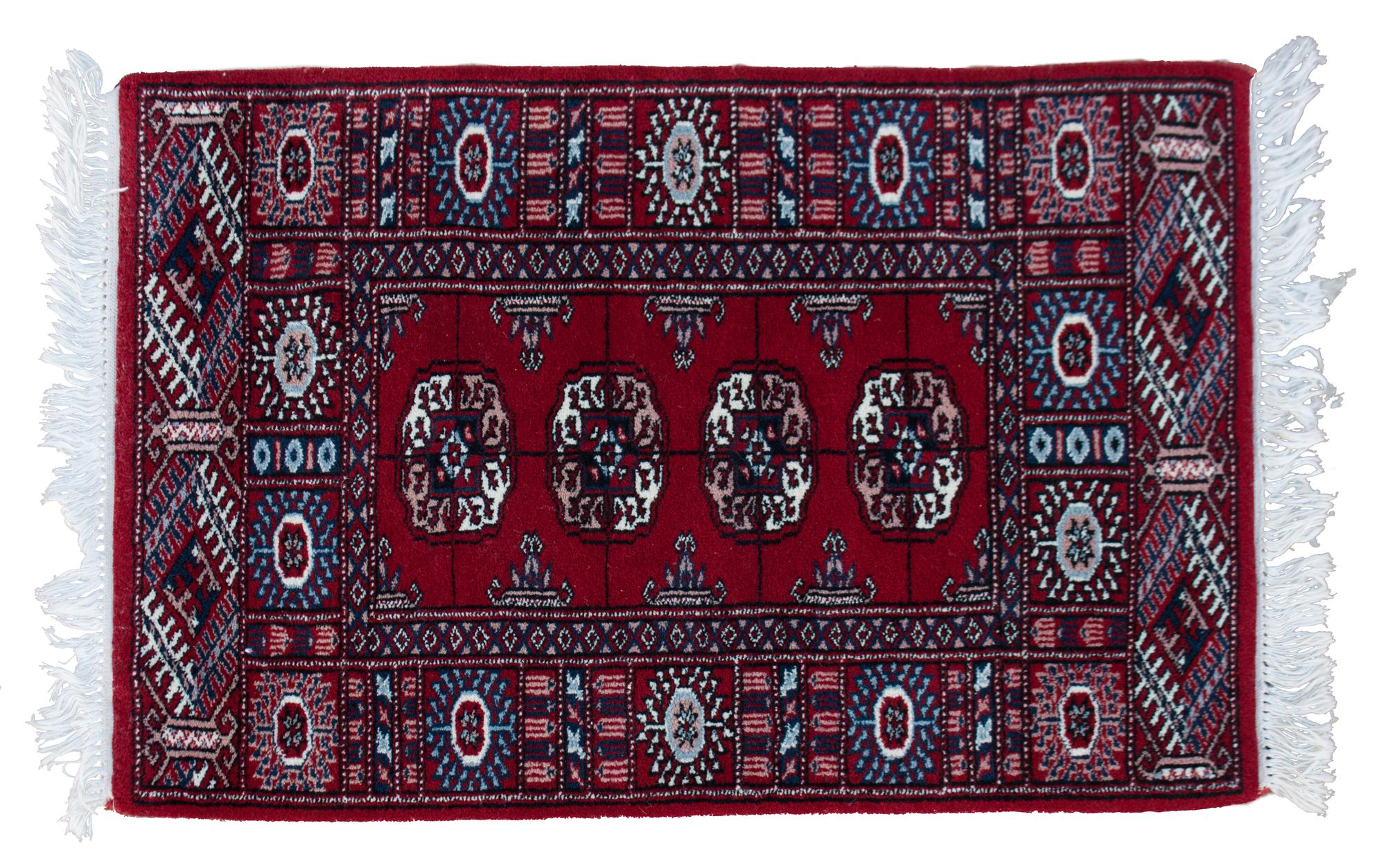 A Bokhara Wool Rug 3 feet 2 inches x 2 feet 1 inch.