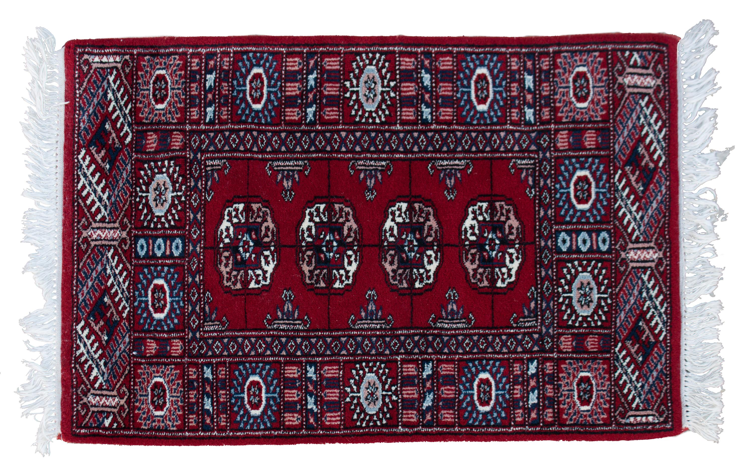 A Bokhara Wool Rug 3 feet 2 inches x 2 feet 1 inch.