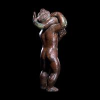 A Roman Bronze Eros with a Dolphin