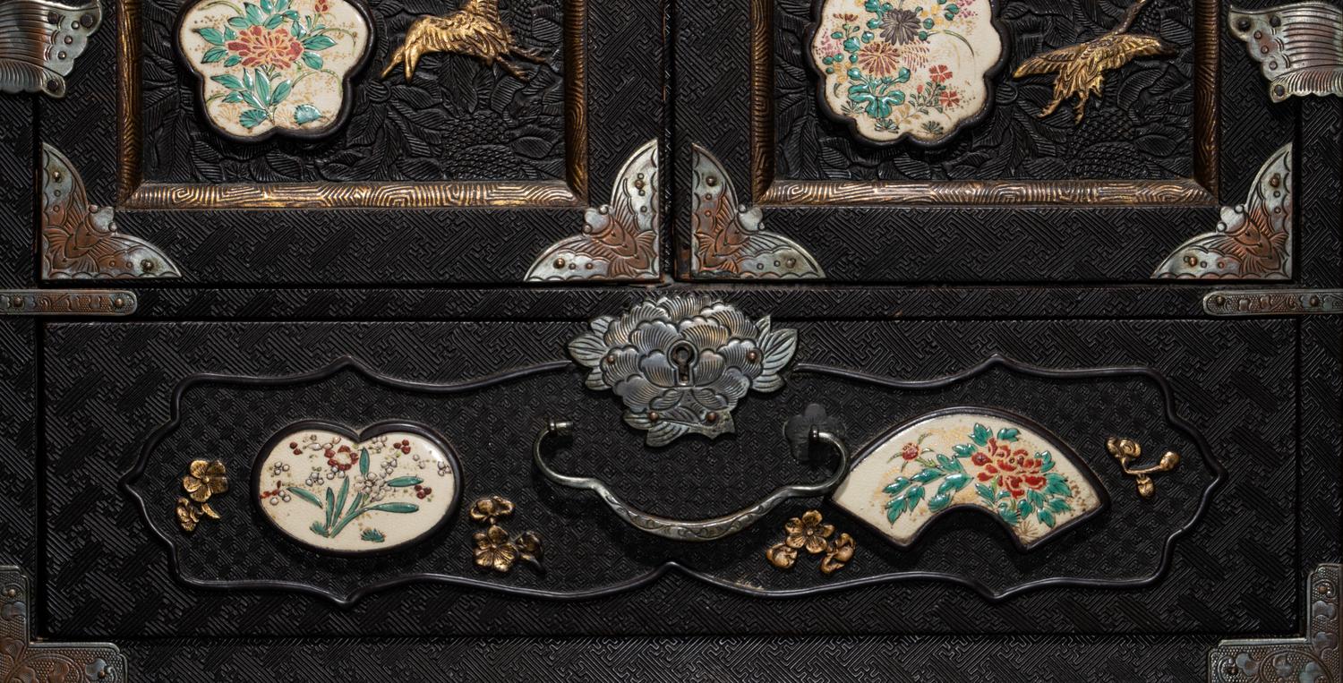 A Japanese Porcelain and Metal Inset Wood Chest