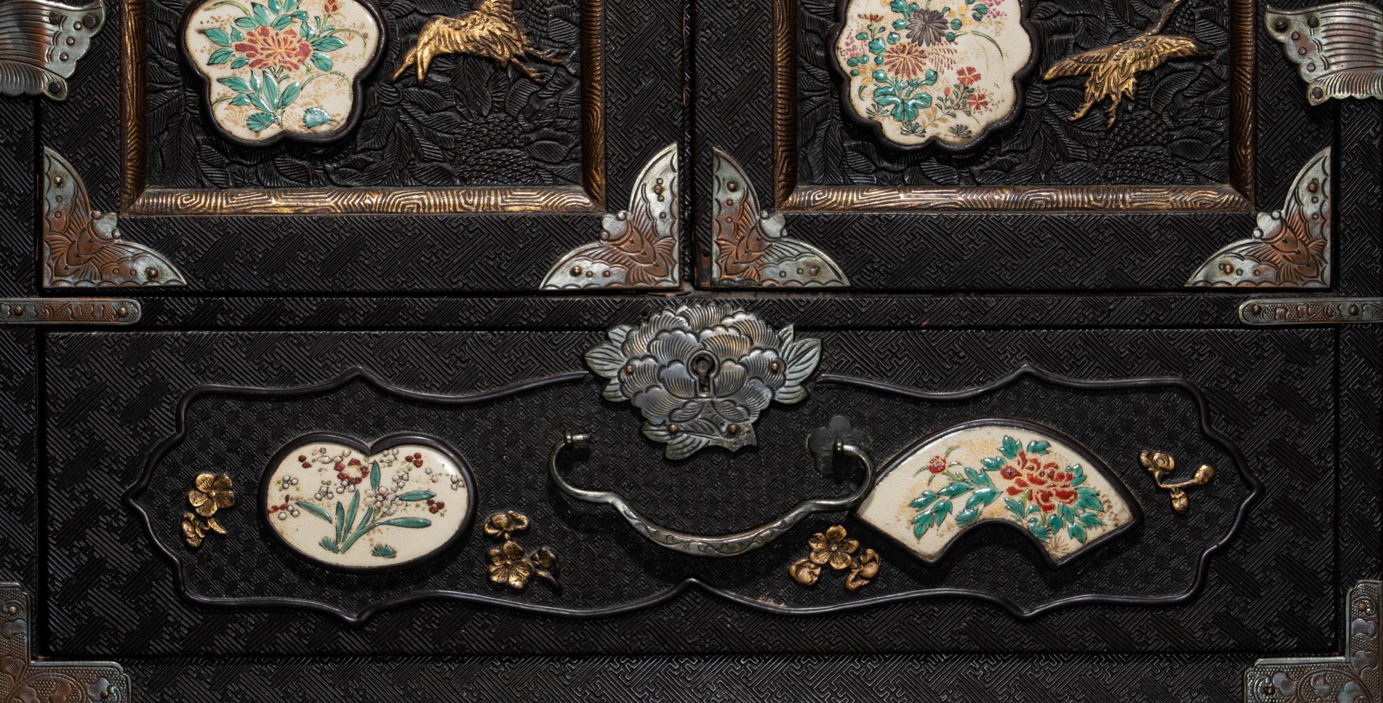 A Japanese Porcelain and Metal Inset Wood Chest