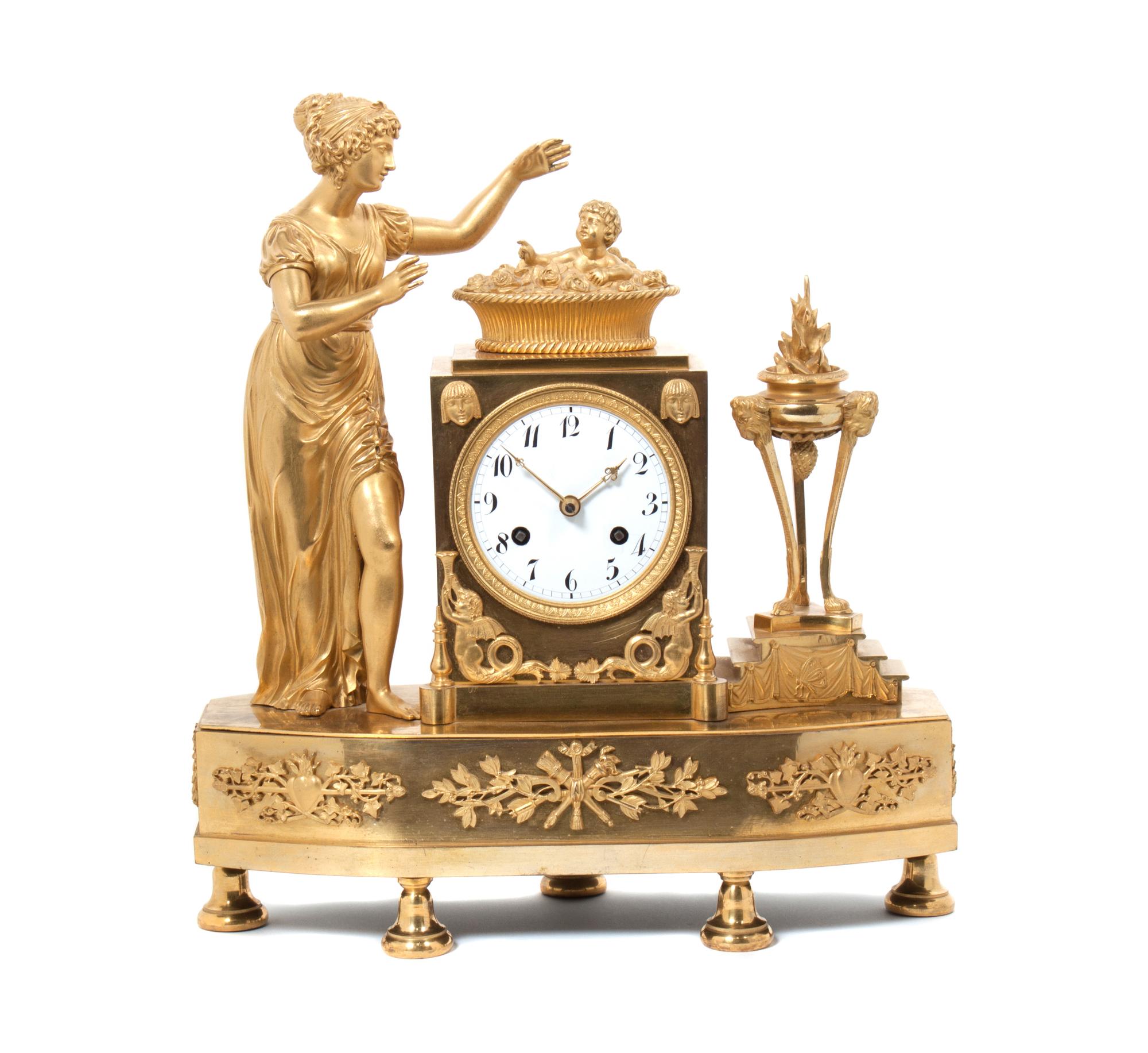A French Gilt Bronze Figural Mantle Clock Height 15 inches. — 19TH CENTURY