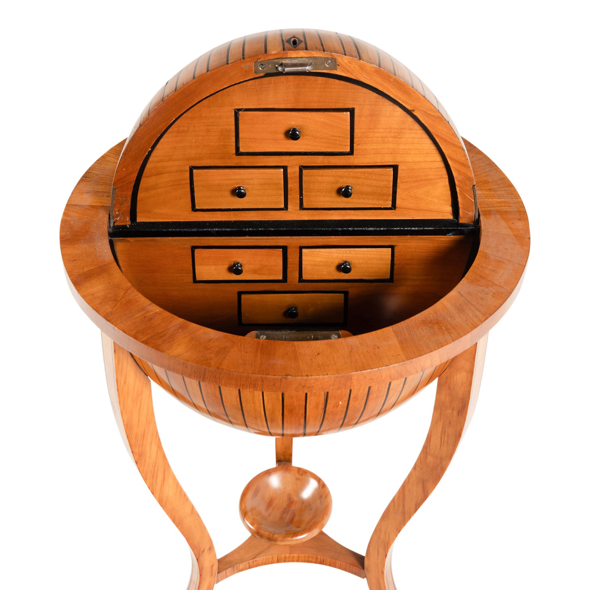 A Biedermeier Part-Ebonized Fruitwood Globe-Form Work Box