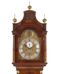 A George III Brass Mounted and Figured Mahogany Tall Case Clock