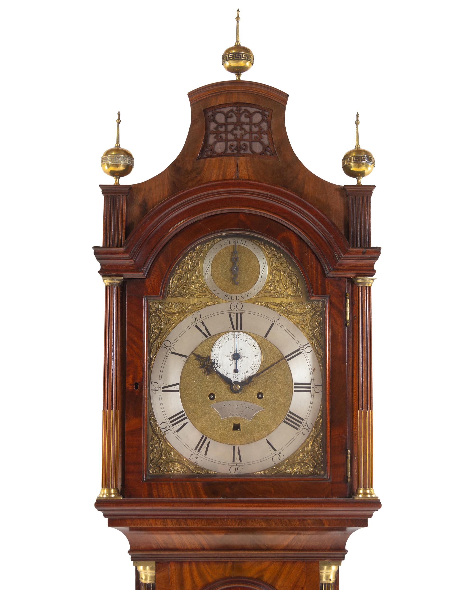 A George III Brass Mounted and Figured Mahogany Tall Case Clock