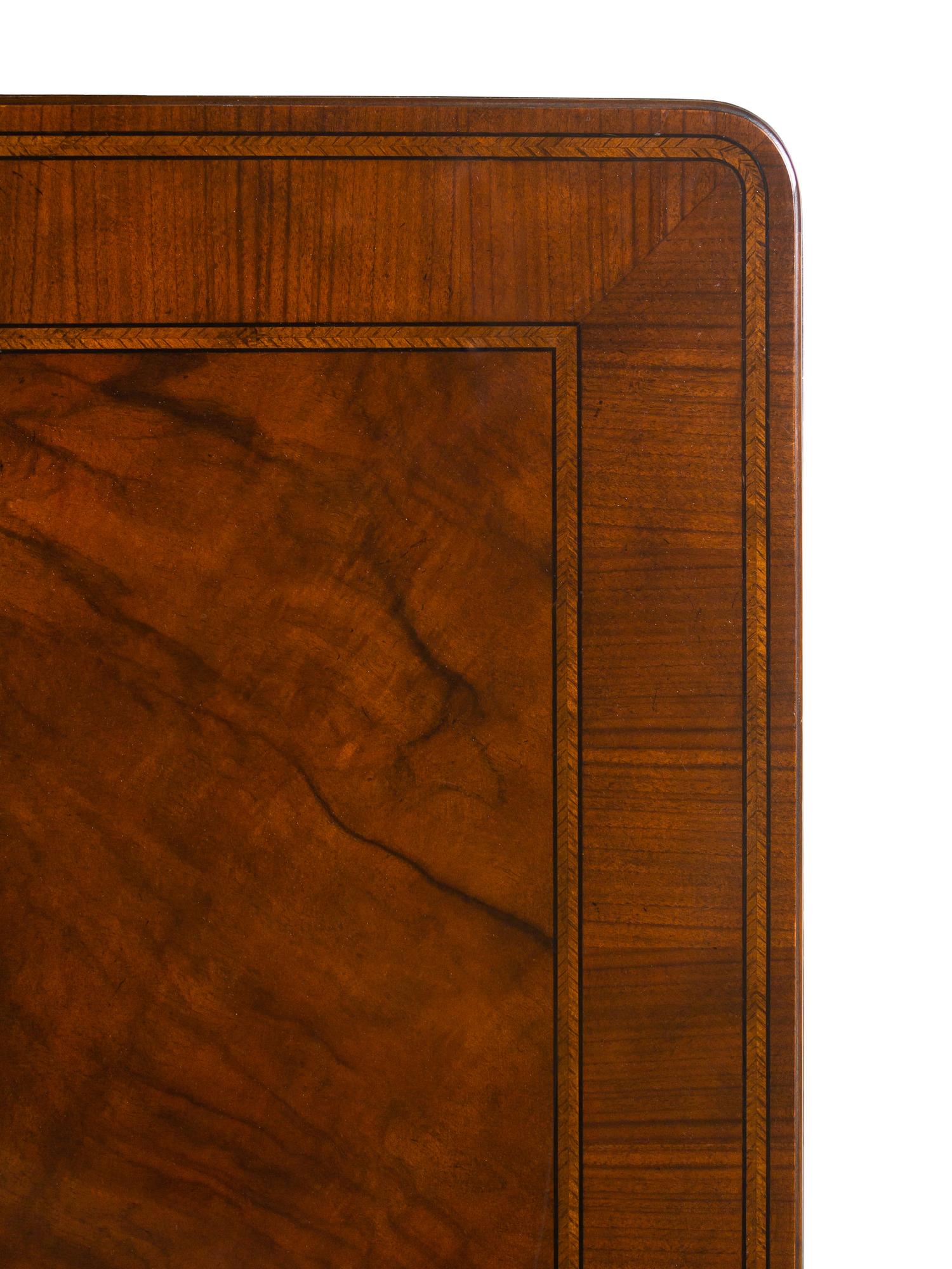 A Baker George II Style Walnut Dining Table