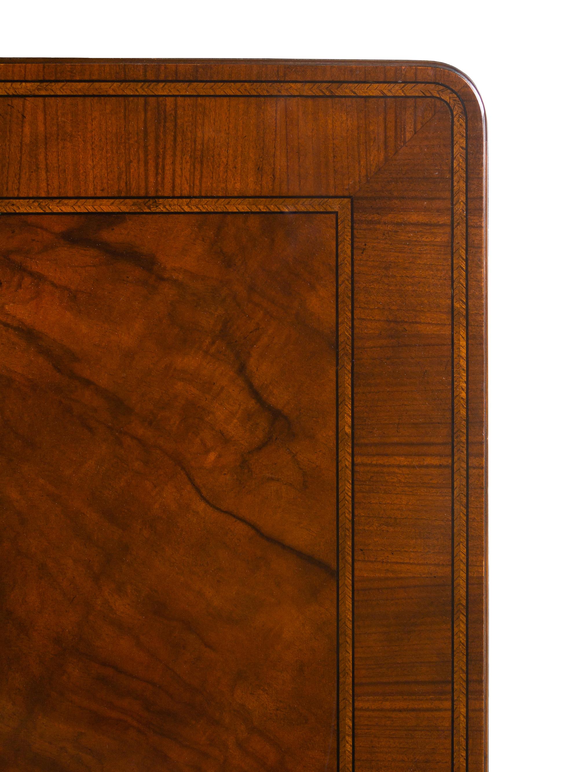 A Baker George II Style Walnut Dining Table