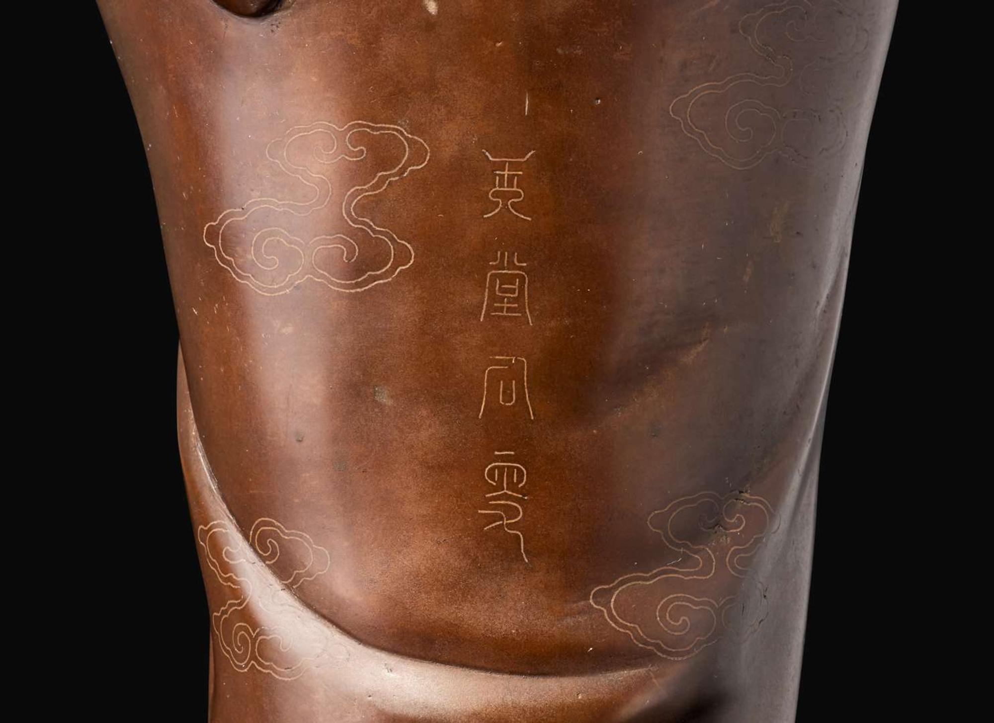 A large silver-inlaid bronze standing figure of Guanyin, signed Yu Tang Shi Sou 銅嵌銀觀音像 玉堂石叟款