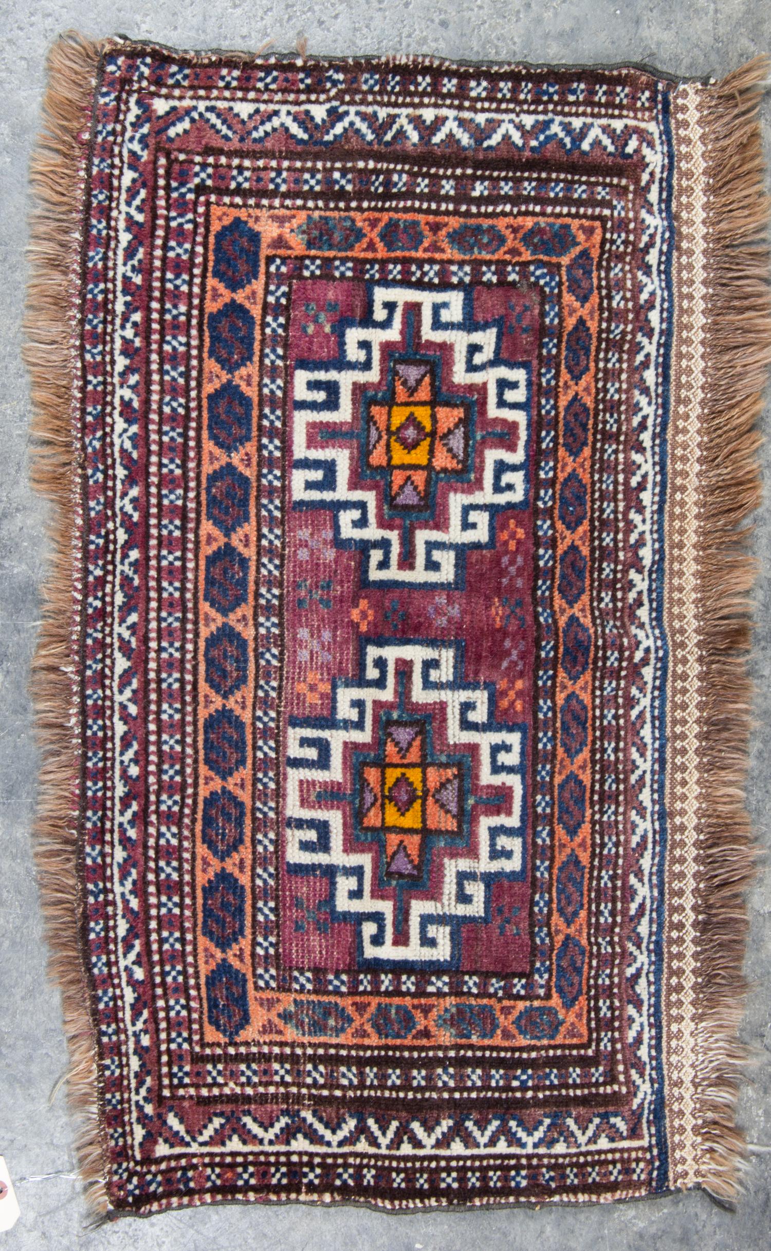 A Group of Three Rugs Largest 5 feet 10 inches x 3 feet 4 inches.