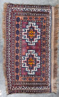 A Group of Three Rugs Largest 5 feet 10 inches x 3 feet 4 inches.