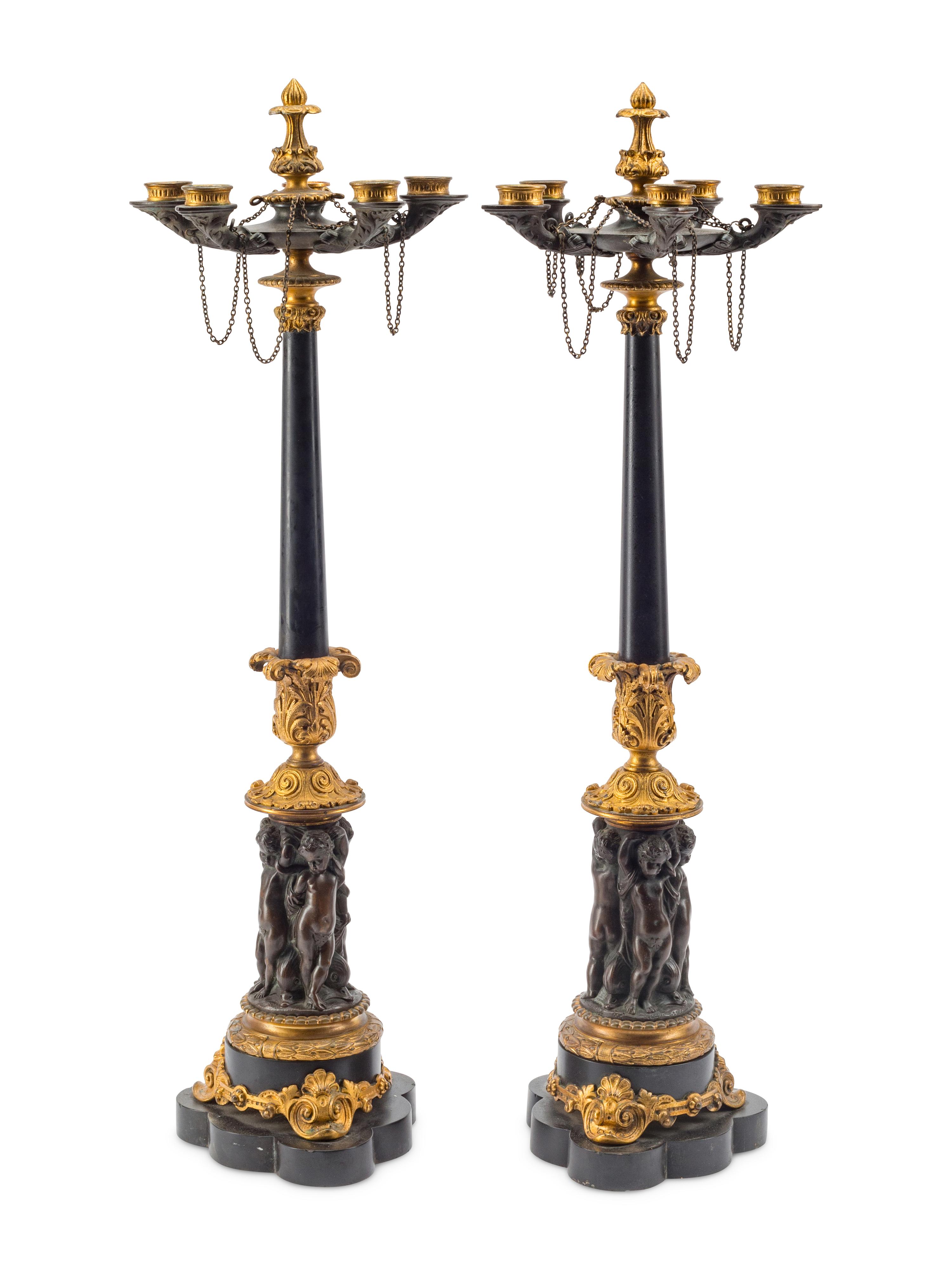 A Pair of French Gilt and Patinated Bronze Five-Light Candelabra