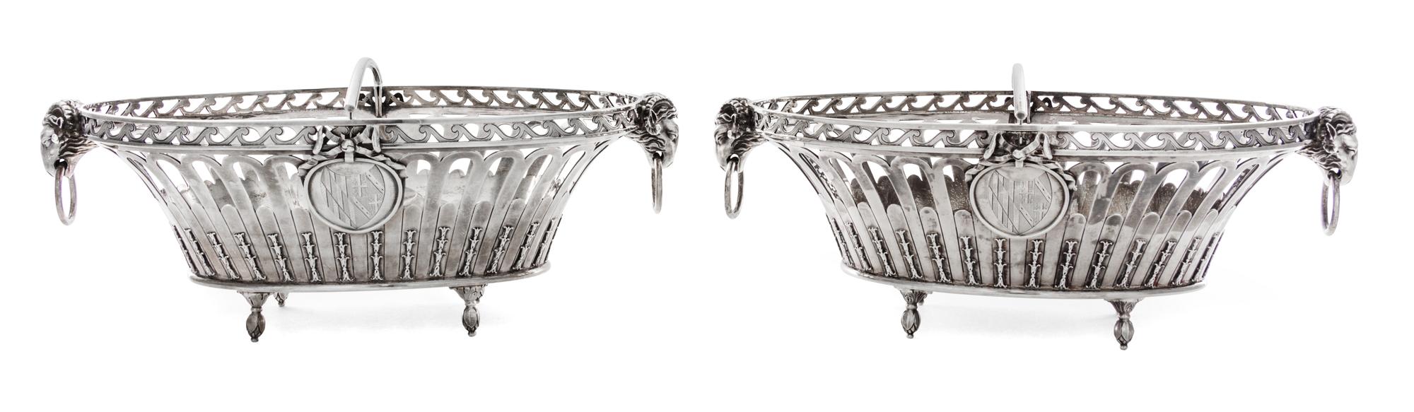 A Pair of George III Silver Baskets, John Wakelin & William Taylor, London, 1790, each of oval, reticulated form, with ram mask ring ha