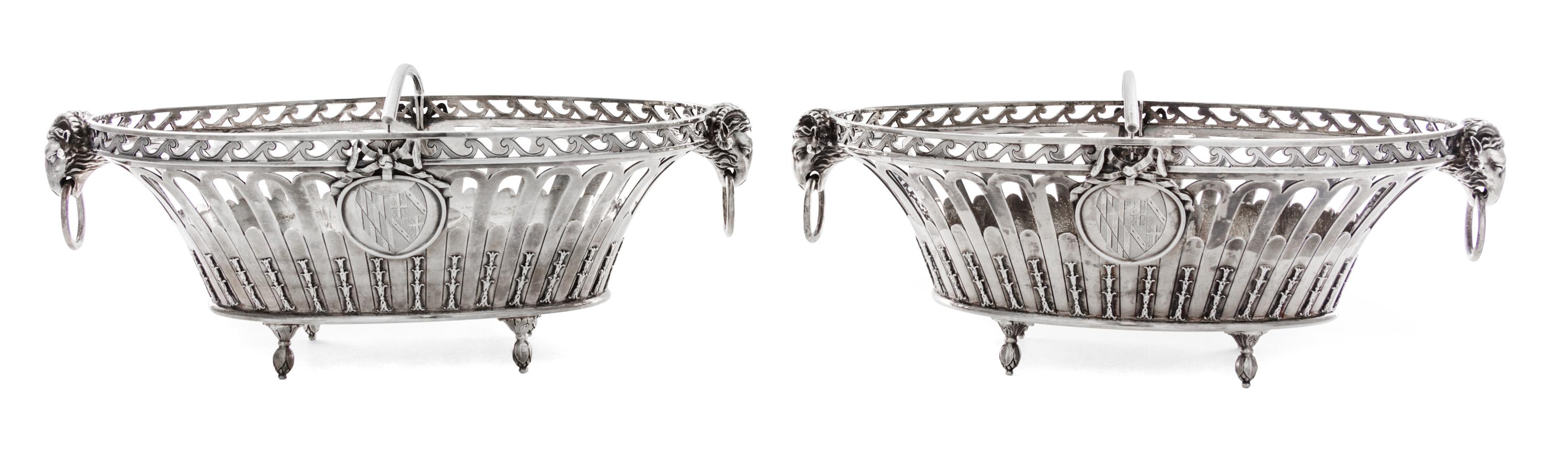A Pair of George III Silver Baskets, John Wakelin & William Taylor, London, 1790, each of oval, reticulated form, with ram mask ring ha