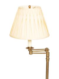 A Group of Four Brass Adjustable Floor Lamps