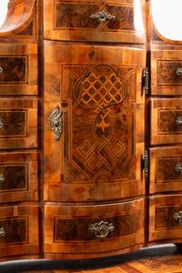 A German or Austrian Walnut and Marquetry Tabernacle Cabinet and Chest of Drawers