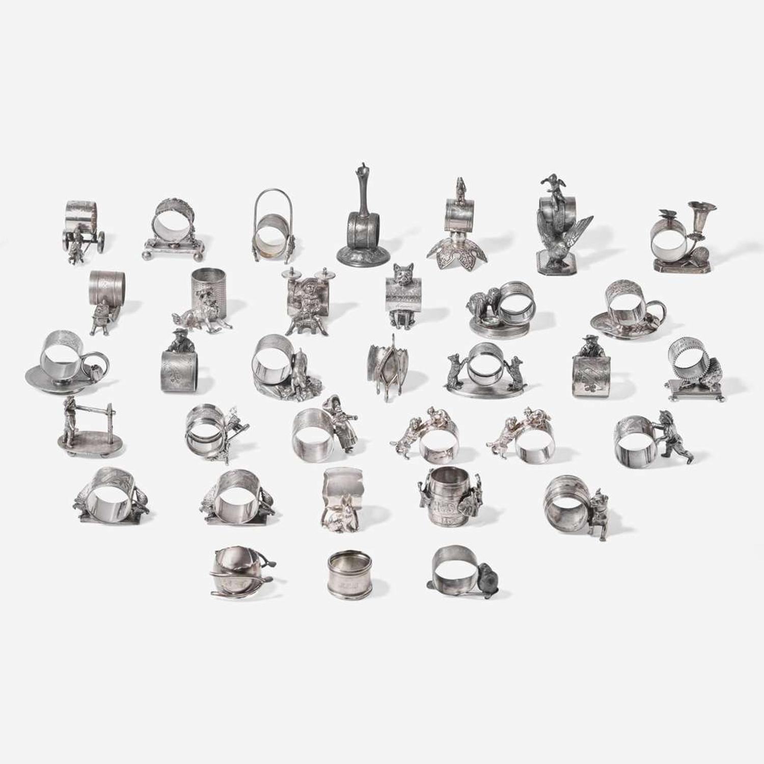 A collection of thirty-four Victorian silverplated and pewter napkin holders Various American and Canadian makers, Connecticut, Massachusetts, and Ontario, late 19th century