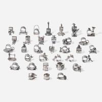 A collection of thirty-four Victorian silverplated and pewter napkin holders Various American and Canadian makers, Connecticut, Massachusetts, and Ontario, late 19th century