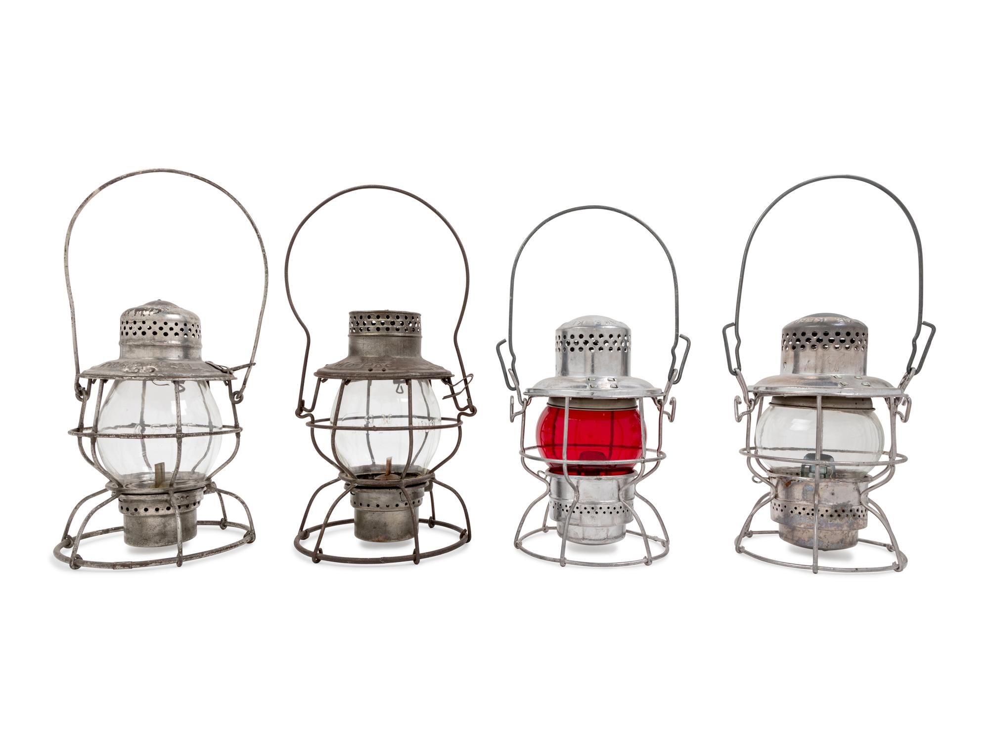 A Group of Four Chromed Metal Railroad Signal Lanterns