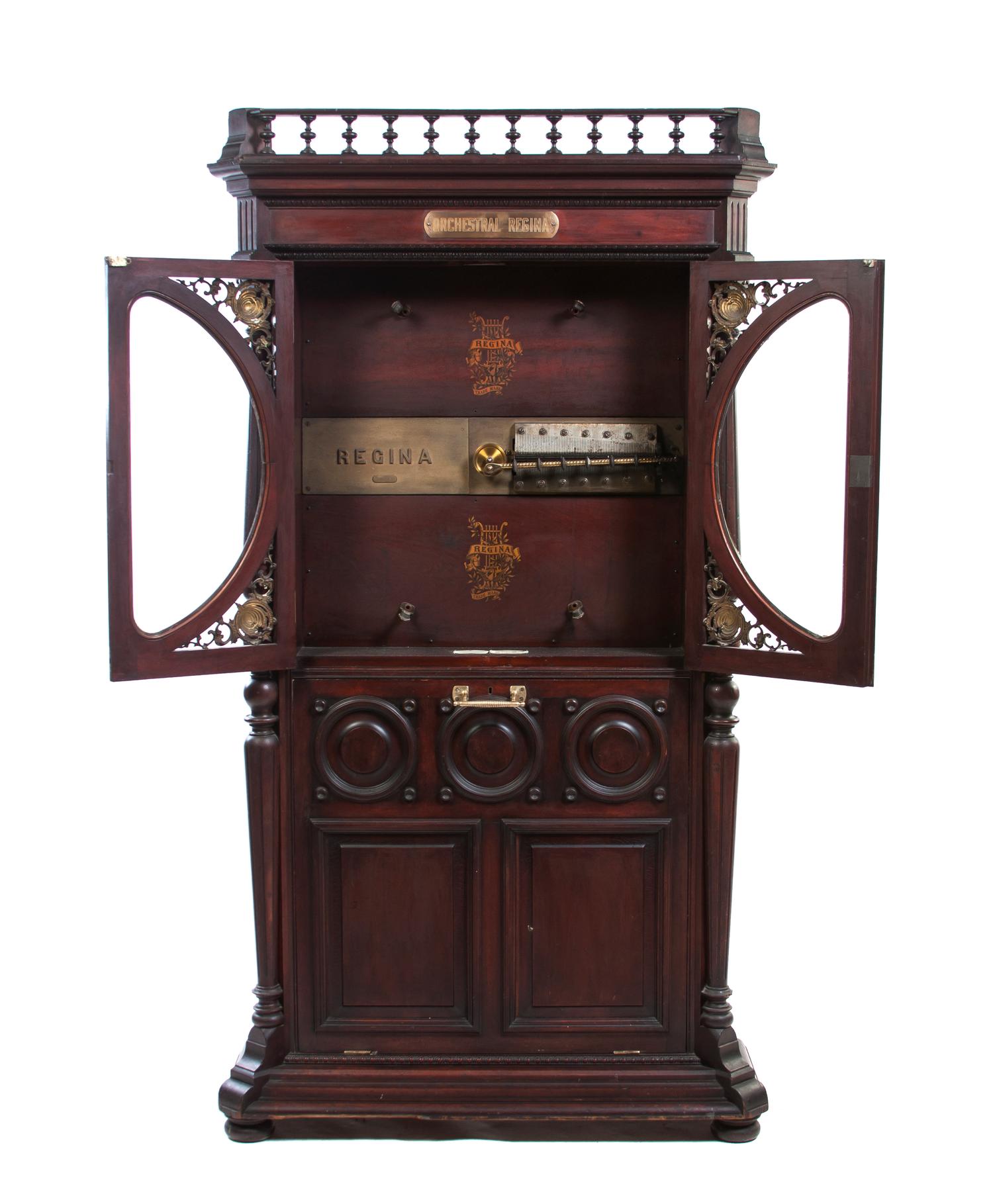 A Orchestral Regina Upright Music Box, Height 77 1/2 x width 42 3/4 x depth 17 inches.