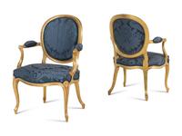 A Set of Six George III Carved Giltwood Armchairs