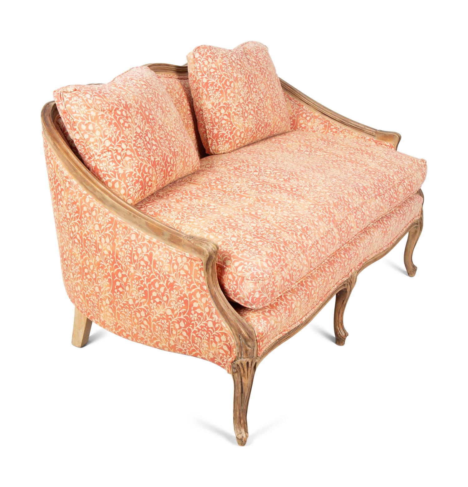 A French Provincial Carved Fruitwood Settee — 20TH CENTURY