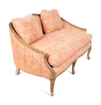 A French Provincial Carved Fruitwood Settee — 20TH CENTURY