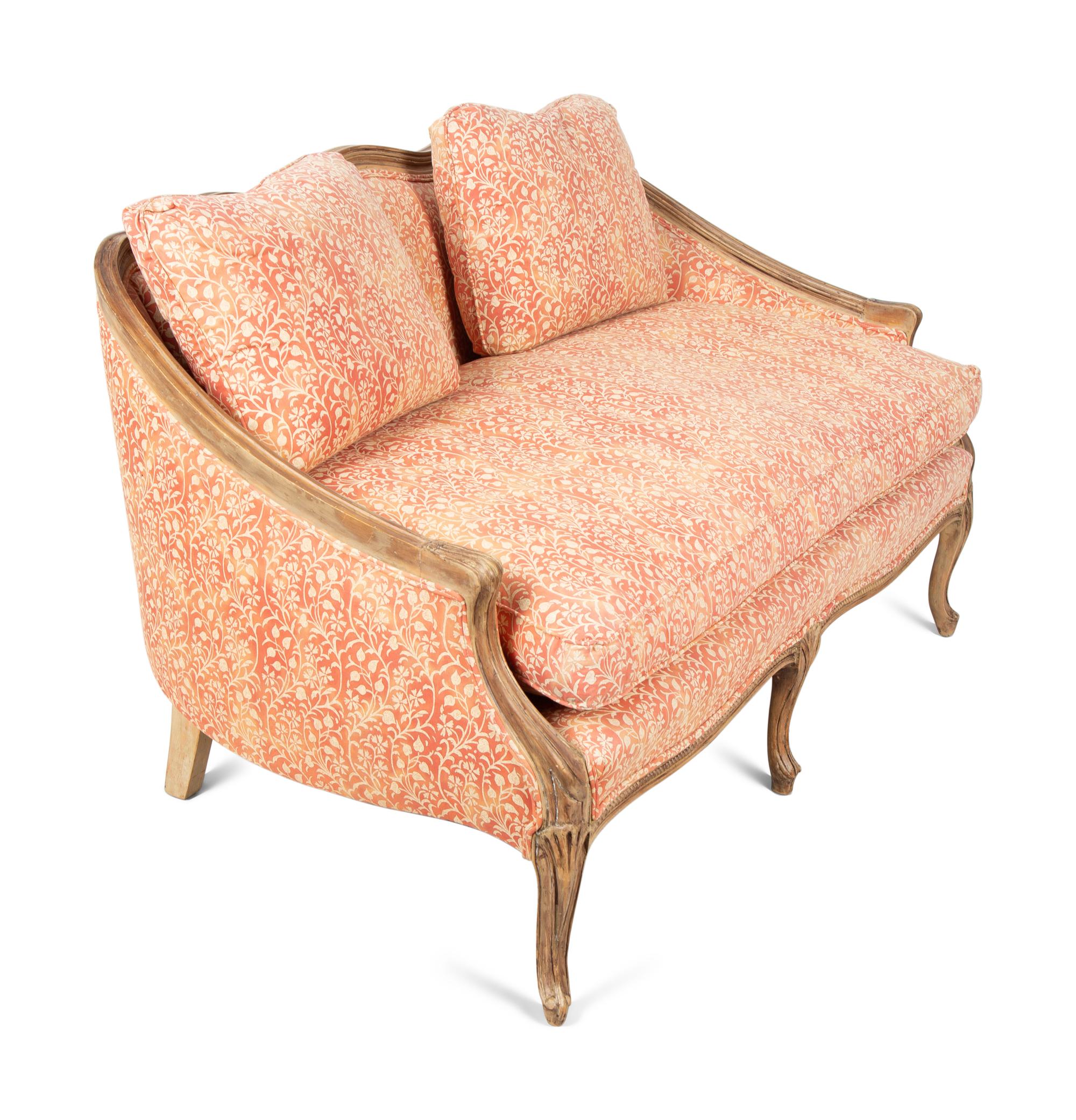 A French Provincial Carved Fruitwood Settee — 20TH CENTURY