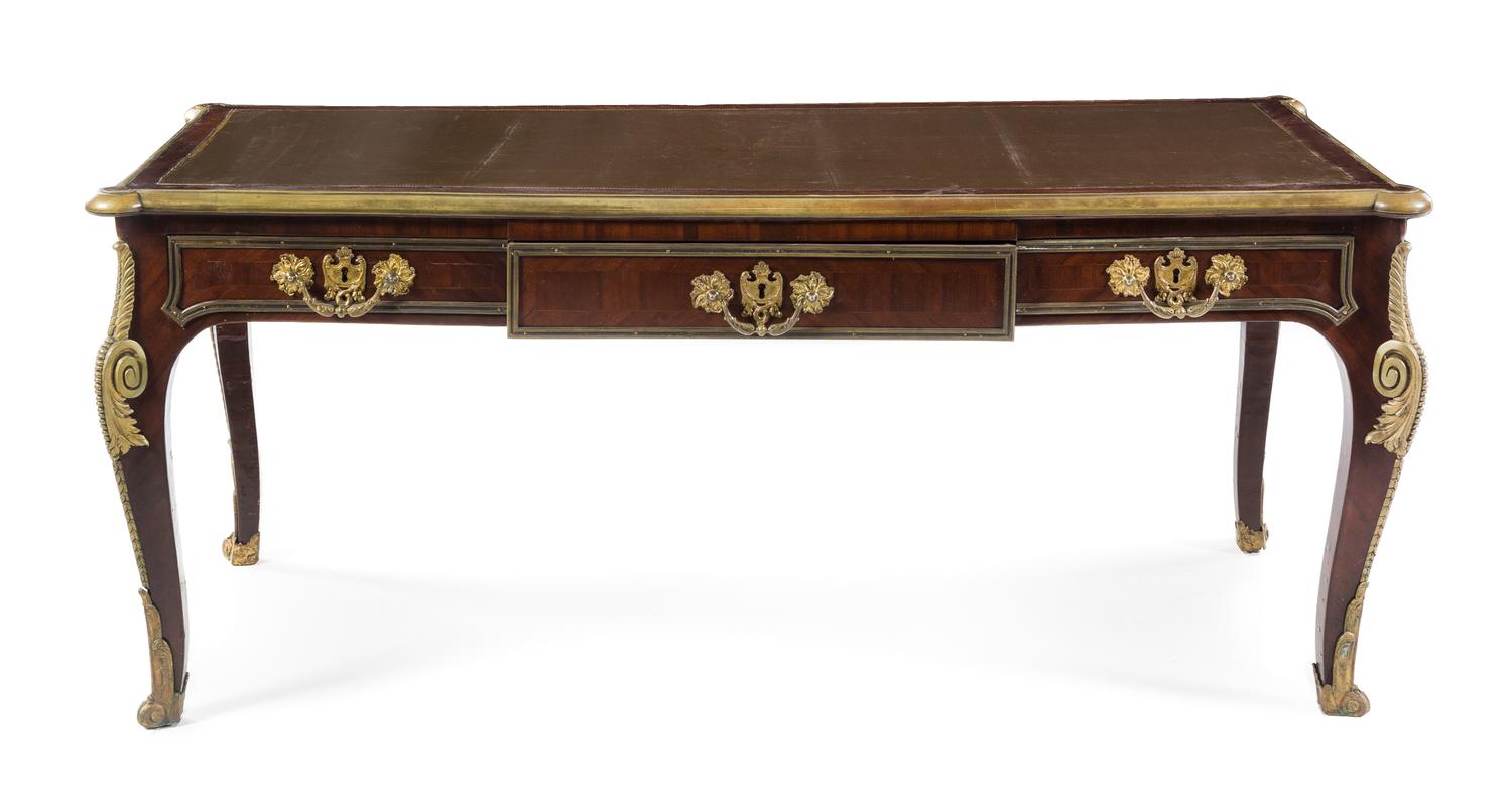 A Louis XV Style Gilt Bronze Mounted Mahogany Bureau Plat Height 29 1/2 x width 71 x depth 32 1/2 inches. — 19TH/20TH CENTURY