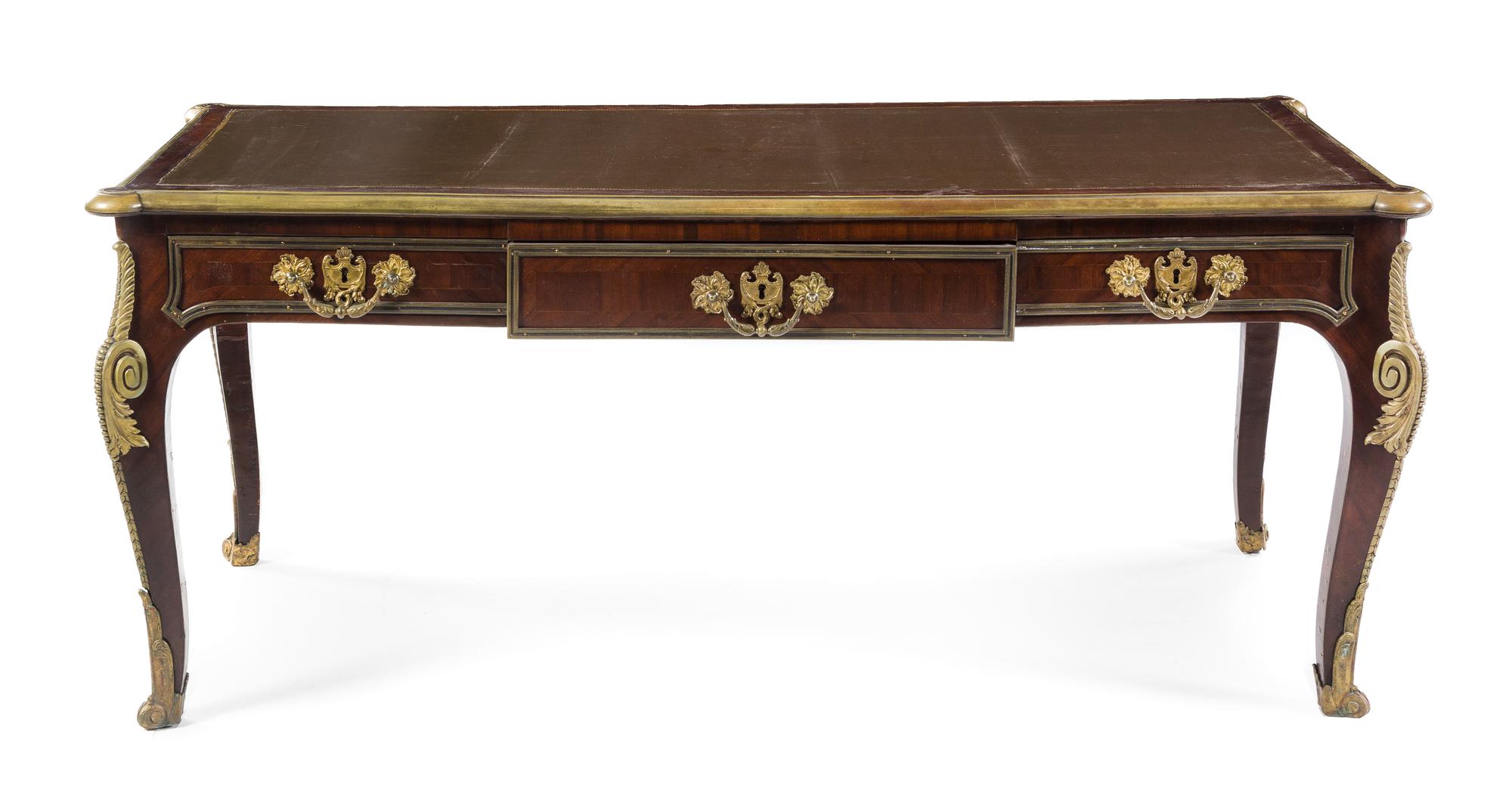 A Louis XV Style Gilt Bronze Mounted Mahogany Bureau Plat Height 29 1/2 x width 71 x depth 32 1/2 inches. — 19TH/20TH CENTURY