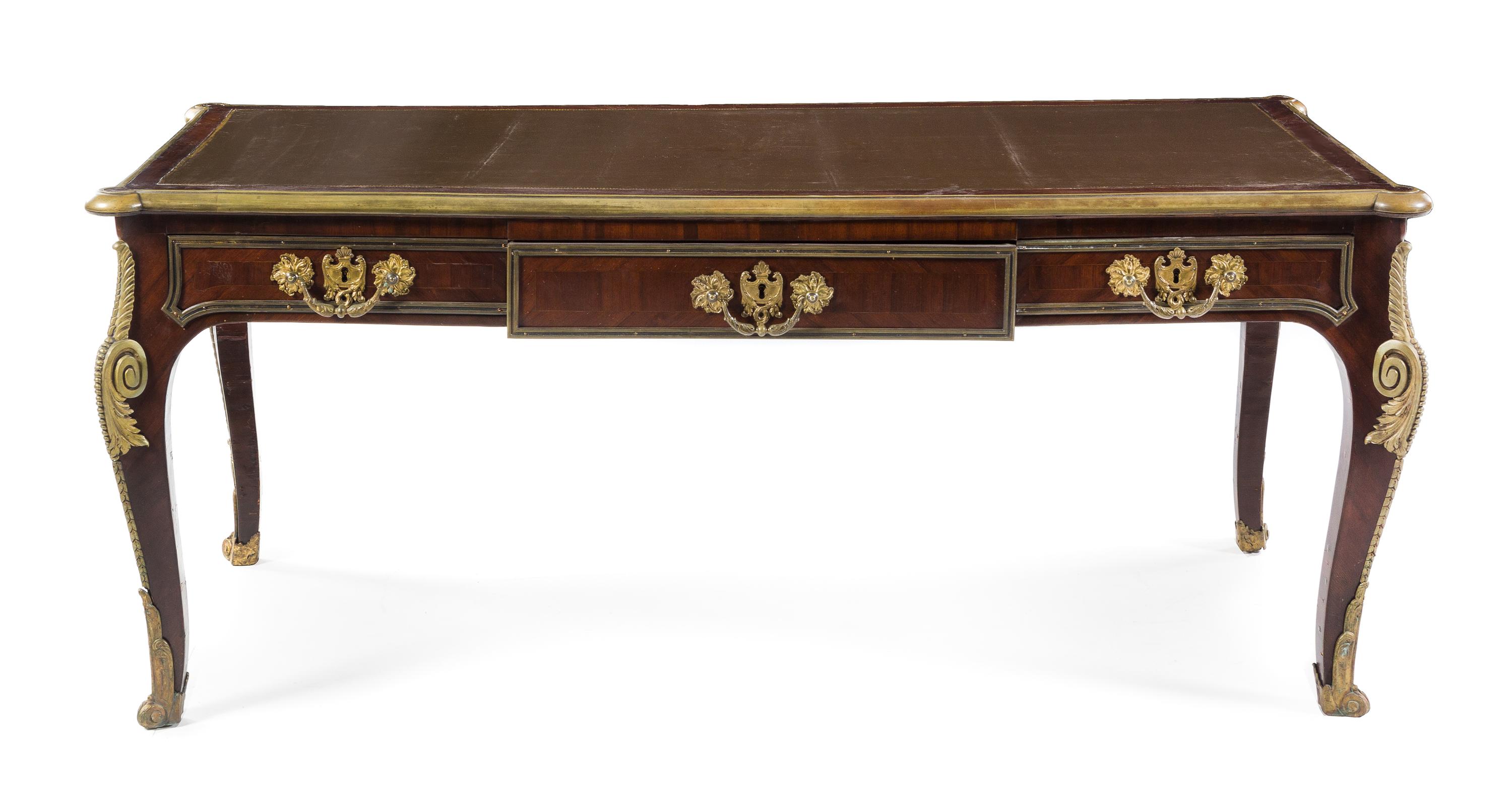 A Louis XV Style Gilt Bronze Mounted Mahogany Bureau Plat Height 29 1/2 x width 71 x depth 32 1/2 inches. — 19TH/20TH CENTURY