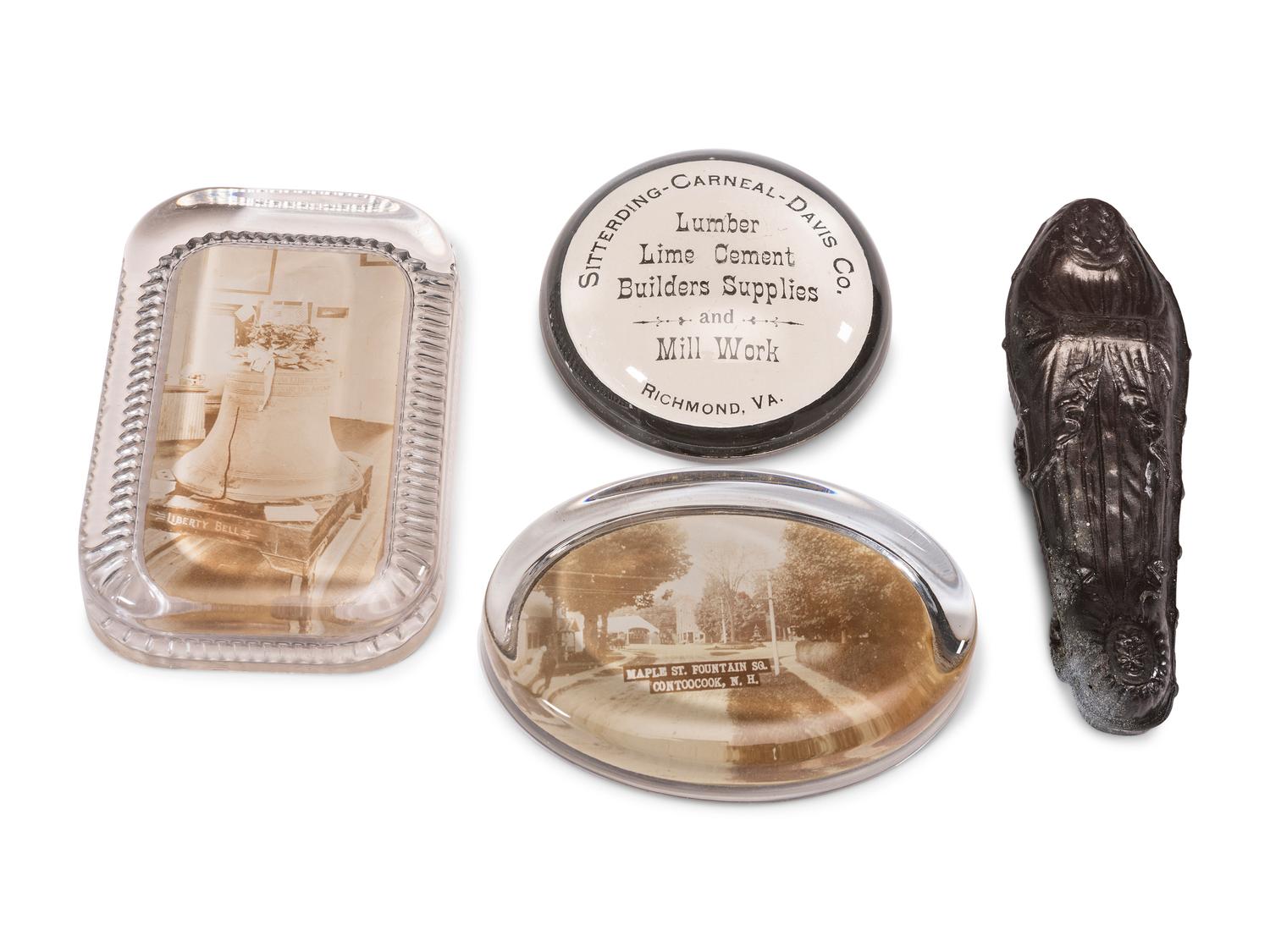 A Group of Advertising Paperweights and Glass Apothecary Bottles