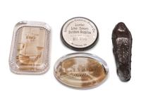 A Group of Advertising Paperweights and Glass Apothecary Bottles