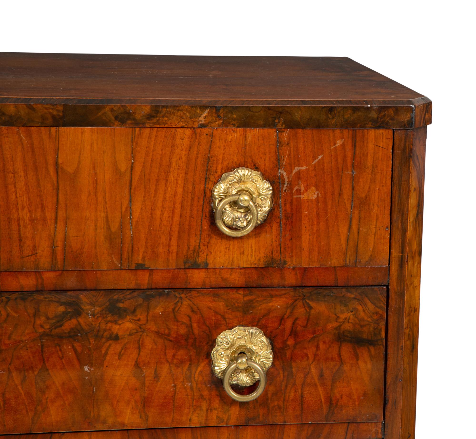 A Biedermeier Walnut Veneered and Grain-Painted Commode