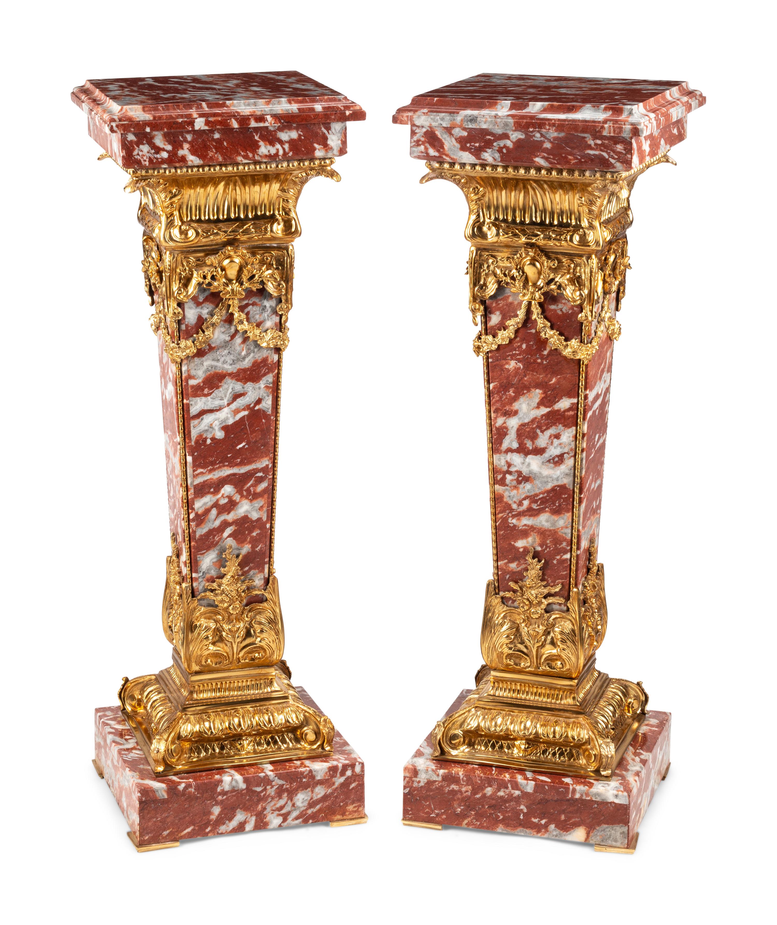 A Pair of Continental Gilt Bronze Mounted Rouge Marble Pedestals