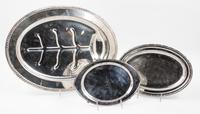Three Silver-plate Trays, 20TH CENTURY, each of oval form comprising a Sheffield well and tree meat platter, an International for Pullm