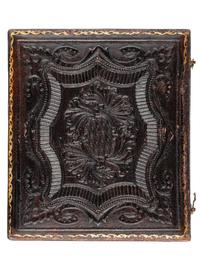 [EARLY PHOTOGRAPHY-AFRICAN AMERICANA]. Sixth plate daguerreotype portrait of subject identified as "Grandma Binx" with braided hairwork heart.