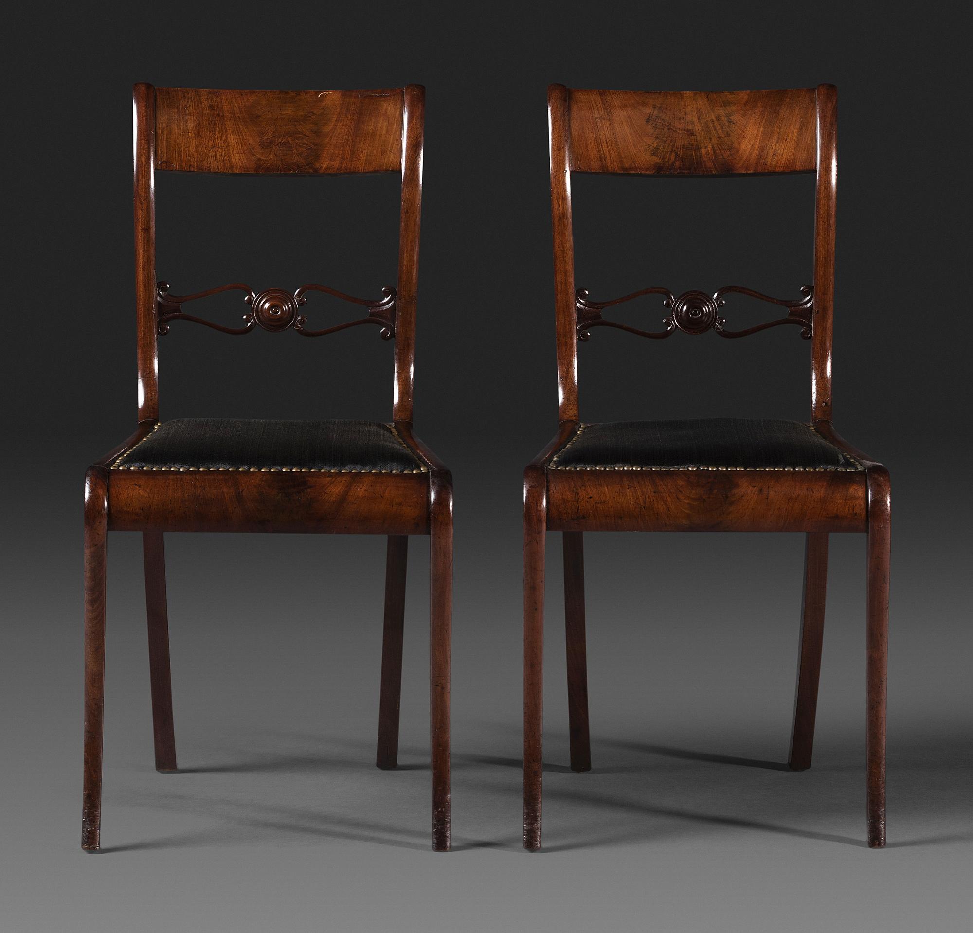 A Pair of Classical Figured and Carved Mahogany Klismos Side Chairs