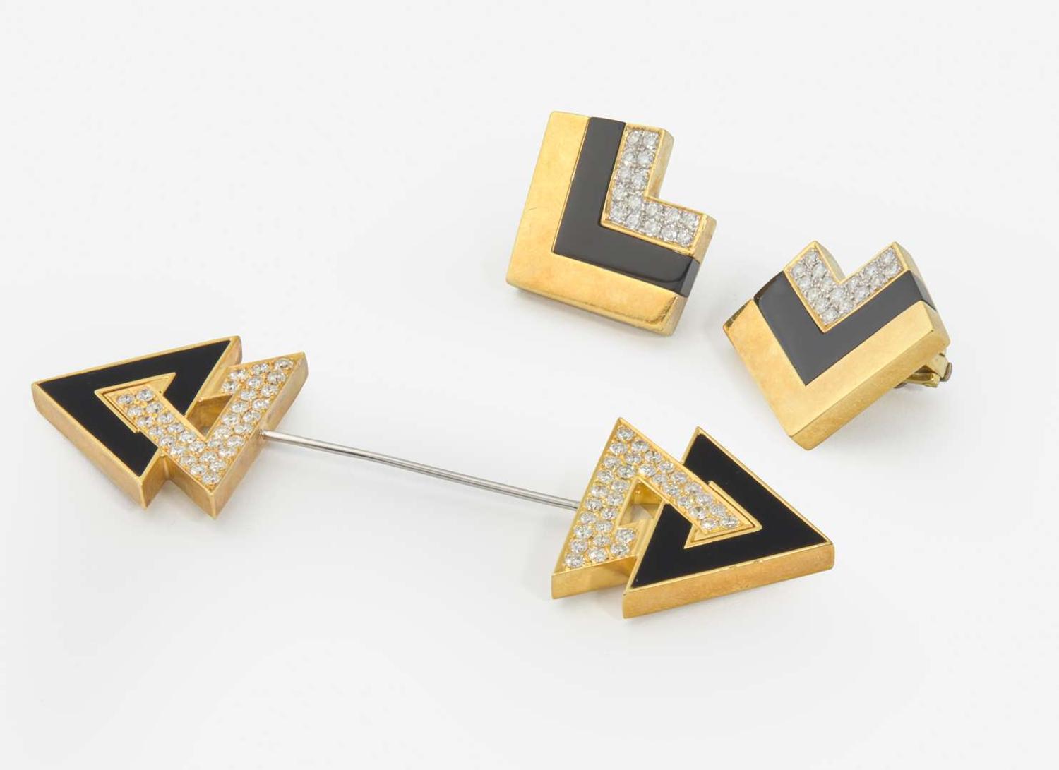 An 18K Yellow Gold, Diamond, and Onyx Jabot Pin and Matching Ear Clips