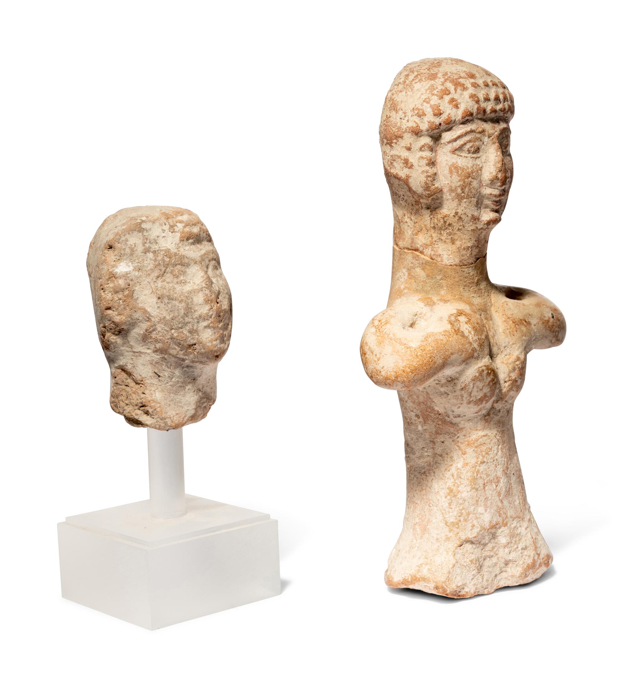 A Near Eastern Terracotta Figure and a Head