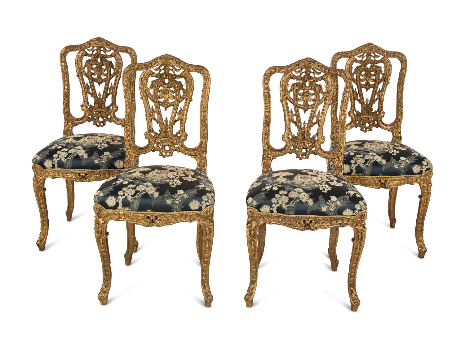 A Set of Four French Rococo Style Carved Gilt Wood Side Chairs