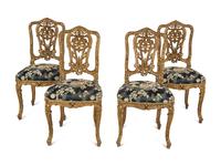 A Set of Four French Rococo Style Carved Gilt Wood Side Chairs