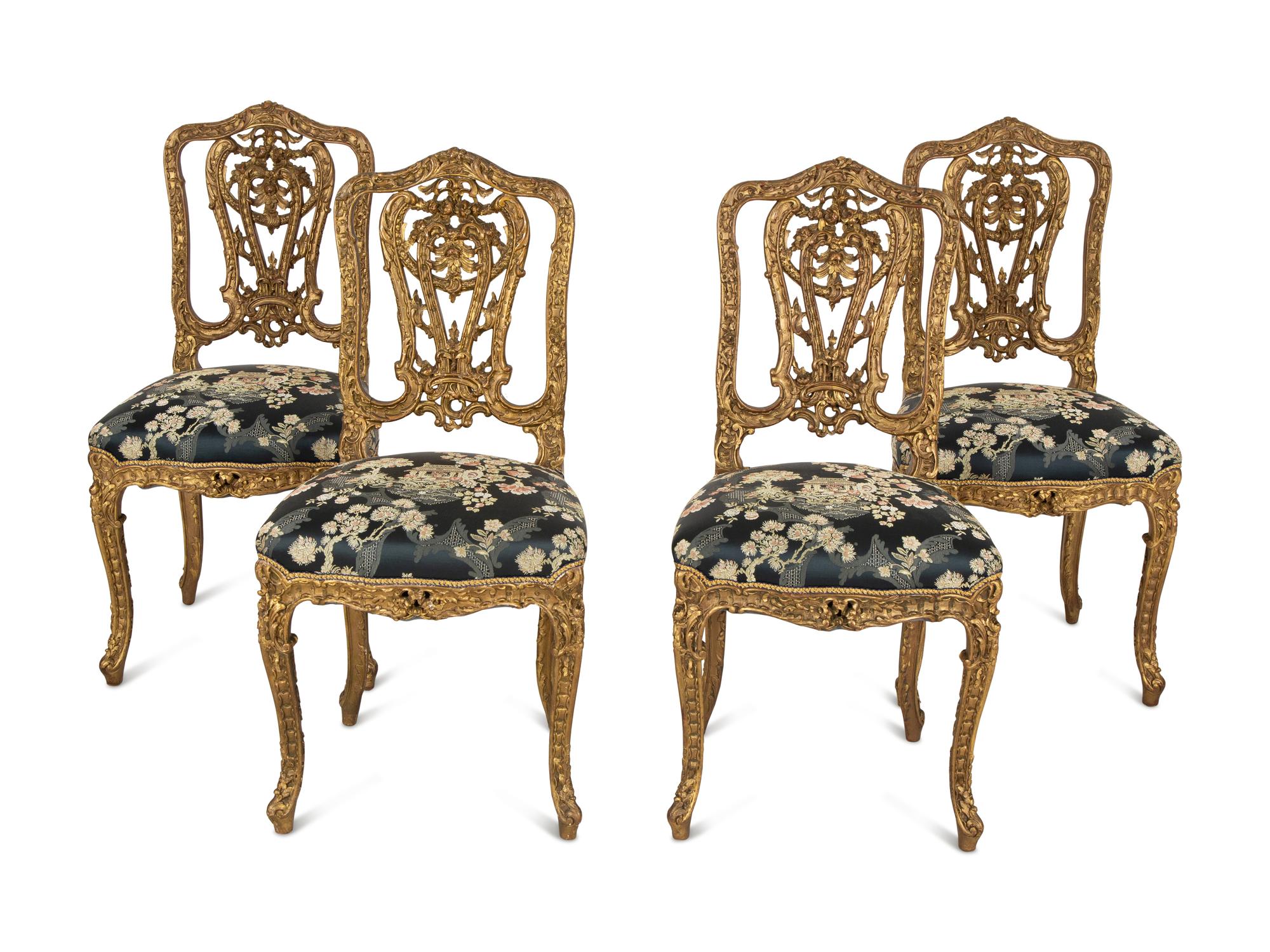 A Set of Four French Rococo Style Carved Gilt Wood Side Chairs